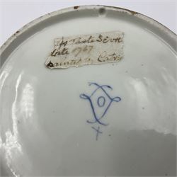 Sèvres soft paste porcelain coffee can and saucer with date code for 1767, painted with floral and laurel leaf garlands within blue scalloped and gilt borders, interlaced LL monogram enclosing the date letter O above painters mark for Catrice, coffee can H7.5cm, saucer D15cm