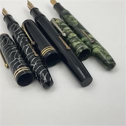 Three Conway Stewart fountain pens, comprising Cracked Ice 28 pen, the black and pearl white barrel engraved Conway Stewart 28 and double banded cap, with gold nib stamped 14ct, together with a Conway Stewart 75 lever fill pen, the green marble barrel and cap with single band and gold nib stamped 14ct and Conway Stewart 55 lever fill fountain pen with black barrel and cap with single broad band and two narrow bands with gold nib stamped Duro 14ct, largest L13cm