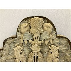 Pair 19th century French Dieppe bone and ivory wall mirrors, the oval bevelled mirror plates within rectangular frames with shaped tops, profusely decorated with ivory leaves, further detailed with carved bone armorial type crest inscribed 'SGOTORVM', putti, fish and mask heads, H81cm W48cm