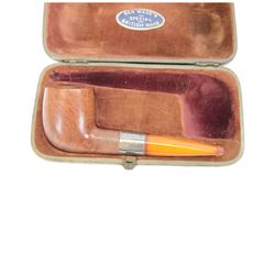 Amber gold mounted cheroot holder, 12.5 ct hallmarked, cased, together with another gold mounted example and various others, and silver mounted pipe 