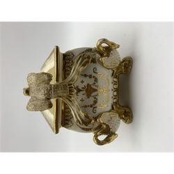 19th century Coalport bough pot, circa 1820, of bombe form, the body with twin handles surmounted by two birds and raised upon four feet modelled as swans, hand painted with two panels depicting an urn of flowers set against a mountainous landscape, the whole heightened in gilt throughout, H13cm L21cm