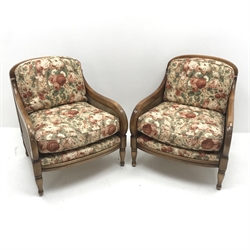 Pair late 20th century walnut framed double cane Bergere armchairs, upholstered in a beige ground floral patterned fabric, turned supports, W74cm