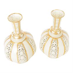Pair of Grainger & Co. Royal China Works Worcester vases, of globular form with knopped elongated neck, with alternating reticulated panels  and gilt highlights, with printed mark beneath each numbered 1963, H19cm