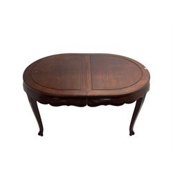 Mid to late 20th century Chinese hardwood extending dining table, two additional leaves, shaped apron carved with foliate scrolls, leaf carved cabriole supports (W246cm, H78cm, D117cm), and set six (4+2) dining chairs with shaped cresting rails over carved splats