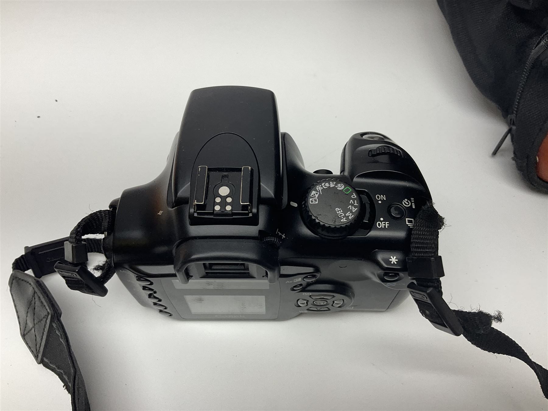 Four camera bodies, to include, Ricoh KR-10 serial no. 38826, Pentax MZ-M serial no. 4185969 with 'SMC Pentax- M 1:3.5 28mm' lens, Canon EOS500 serial no. 080927, with 'Sigma Zoom 100-300mm 1:4.5-6.7 DL'  lens etc, with other camera lenses and equipment 