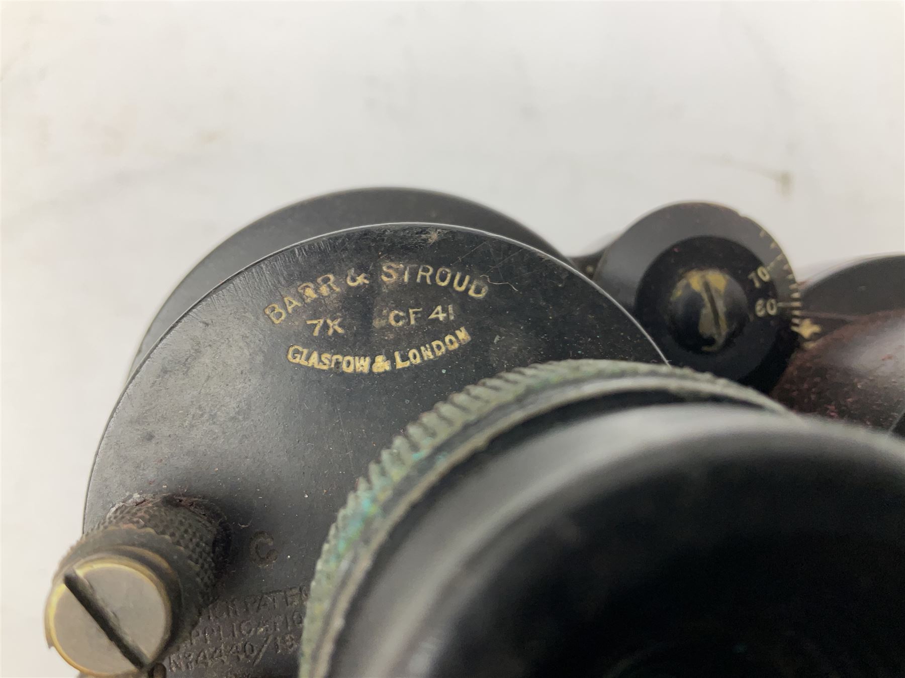 Pair of WWII Barr and Stroud CF41 naval binoculars,  A.P.1900A, with painted broad yellow military arrows, engraved Barr & Stroud, 7X CF 41, Glasgow & London, Serial no. 62984 with leather lens covers and case, H24cm