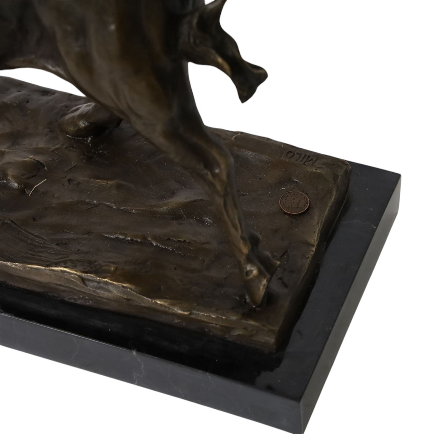 Bronze figure, modelled as a bull, upon naturalistically modelled rectangular base signed Milo and with foundry mark, raised upon black marble base, H27cm L36cm