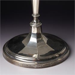 Pair of silver candlesticks with octagonal tapering stems and circular weighted bases H30cm Sheffield 1923 Maker Hawksworth Eyre & Co Ltd