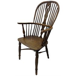 19th century yew wood and elm Windsor chair, high hoop and stick back with pierced splat over dished seat, raised on ring turned supports united by crinoline stretcher