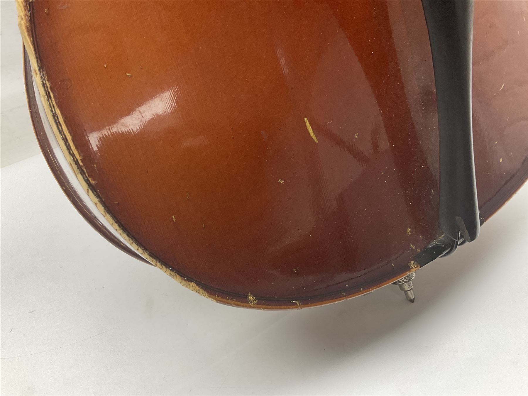 Two student half-size cellos - Boosey & Hawkes Artia with 65cm one-piece back and spruce top; bears maker's label; L104cm overall; and Romanian with 65.5cm two-piece maple back and ribs and spruce top; bears label; L108.5cm overall; each in soft carrying case with two bows (2)