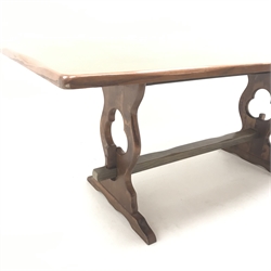  Oak refectory style dining table, pierced and shaped solid end supports joined by stretchers, W185cm, H74cm, D91cm  