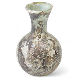 Three Roman glass funerary vessels c. 1st-3rd century AD, comprising a group of free-blown glass vessels: two unguentaria with elongated necks and rounded bases, and one squat lachrymatory or tear bottle, heights: 7.5cm, 6.5cm and 5cm
Notes: Unguentaria held oils/perfumes; small bottles of this type are traditionally described as ‘lachrymatories’, though their practical use is generally associated with unguents
Provenance: By the vendor’s repute, acquired/collected in the Middle East (Dead Sea area/Syria) in the 1960s