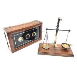 Set of brass and steel balance scales with rise-and-fall action on mahogany oblong base with moulded edge L21.5cm; and a Victorian walnut cased indicator box with three untitled apertures containing indicators inscribed 'Magnet' (2)