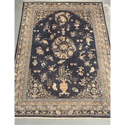Chinese hand knotted wool carpet, first half of the 20th century, the blue field decorated...