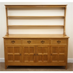  Alan 'Acornman' Grainger of Brandsby, oak dresser with two tier plate rack above one long and two short drawers, three panelled doors and panelled sides, W168cm, H168cm, D49cm  