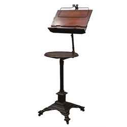  Victorian 'Carters of London' patent adjustable music stand, with manuscript rest above circular dished tier, on fluted column support the stepped square bronzed cast metal base with four out splayed feet, brass castors, H120cm, with ivorine makers plaque.  