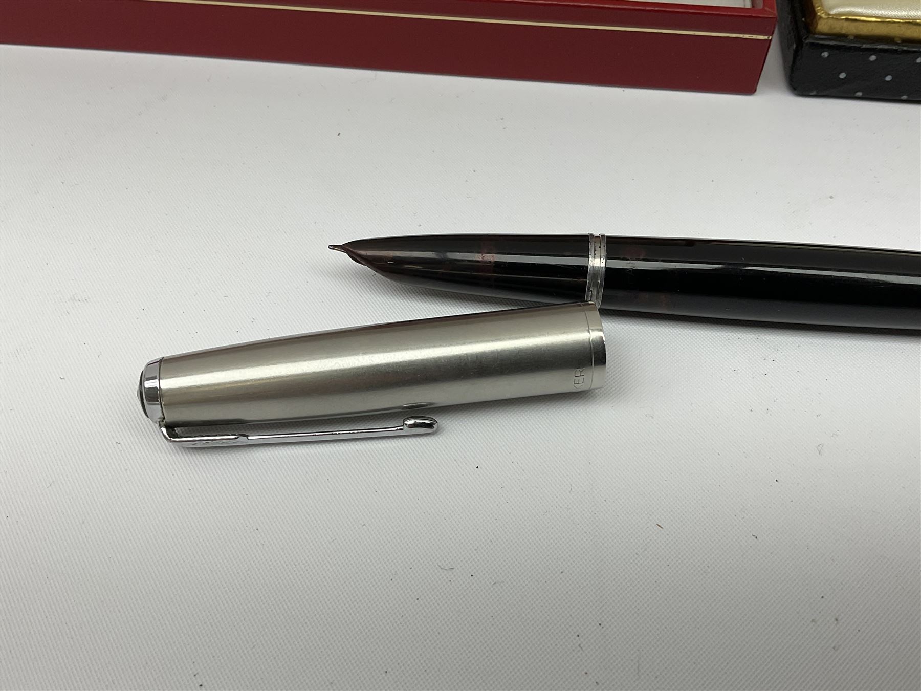 Six fountain pens with gold nibs to include Sheaffer, Macniven & Cameron Ltd and Conway examples, together with four other fountain pens including a boxed Parker pen and a boxed Sheaffer pen in black case with chevron pattern detail