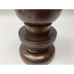 Pair of Arts and Crafts turned oak candlesticks with brass mounted sockets and drip pans, H19cm