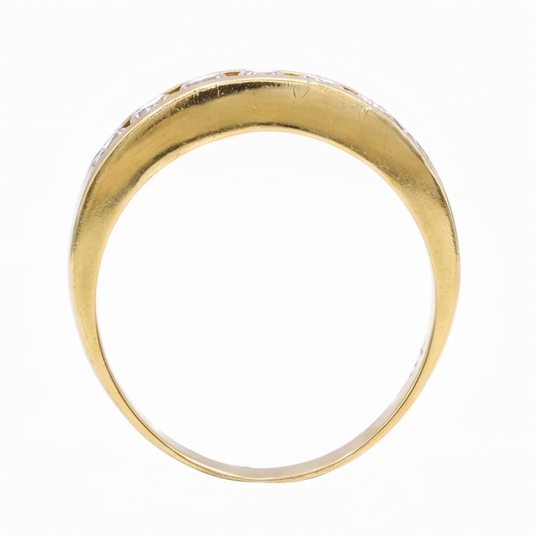 18ct gold diamond ring, channel set with seven round brilliant cut diamonds, hallmarked, total diamond weight 0.75 carat