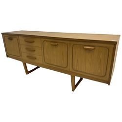 Stonehill - mid-20th century teak 'Stateroom' sideboard, fitted three drawers flanked by fall-front and double cupboard