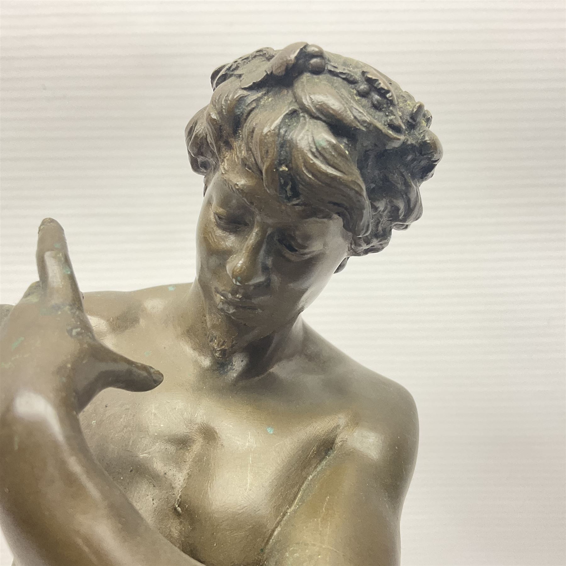 After Felix Carpentier, Improvisateur; bronzed figure of a man playing the flute, marked Felix Charpentier, H35