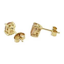 Pair of 9ct gold single stone oval cut morganite stud earrings, stamped