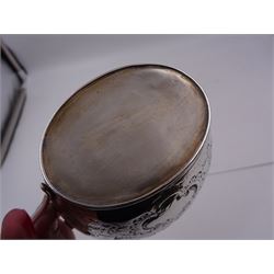 George III silver cream jug, of helmet form with angular handle, embossed with floral and scrolling decoration and engraved initial, hallmarked Edward Mayfield, London 1806, H9.3cm, together with a modern silver 'Sherry' decanter label, hallmarked Birmingham Mint, Birmingham 1986