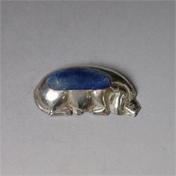 Early 20th century silver novelty pin cushion, modelled as a recumbent pig with blue cushi...