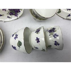 Hammersley Violets pattern tea wares comprising, nine cups and eleven saucers, thirteen dessert plates and two cake plates