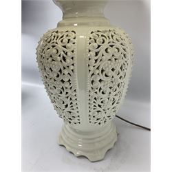 Modern pierced oriental white ceramic vase shaped table lamp, together with a blue and white baluster shaped example decorated with figures upon elephants, both with shades, tallest H83cm incl shade