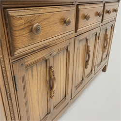 Ercol Old Colonial elm dresser, Golden Dawn finish, raised three tier plate rack above three drawers and three cupboards, stile supports, W147cm, H193cm, D52cm