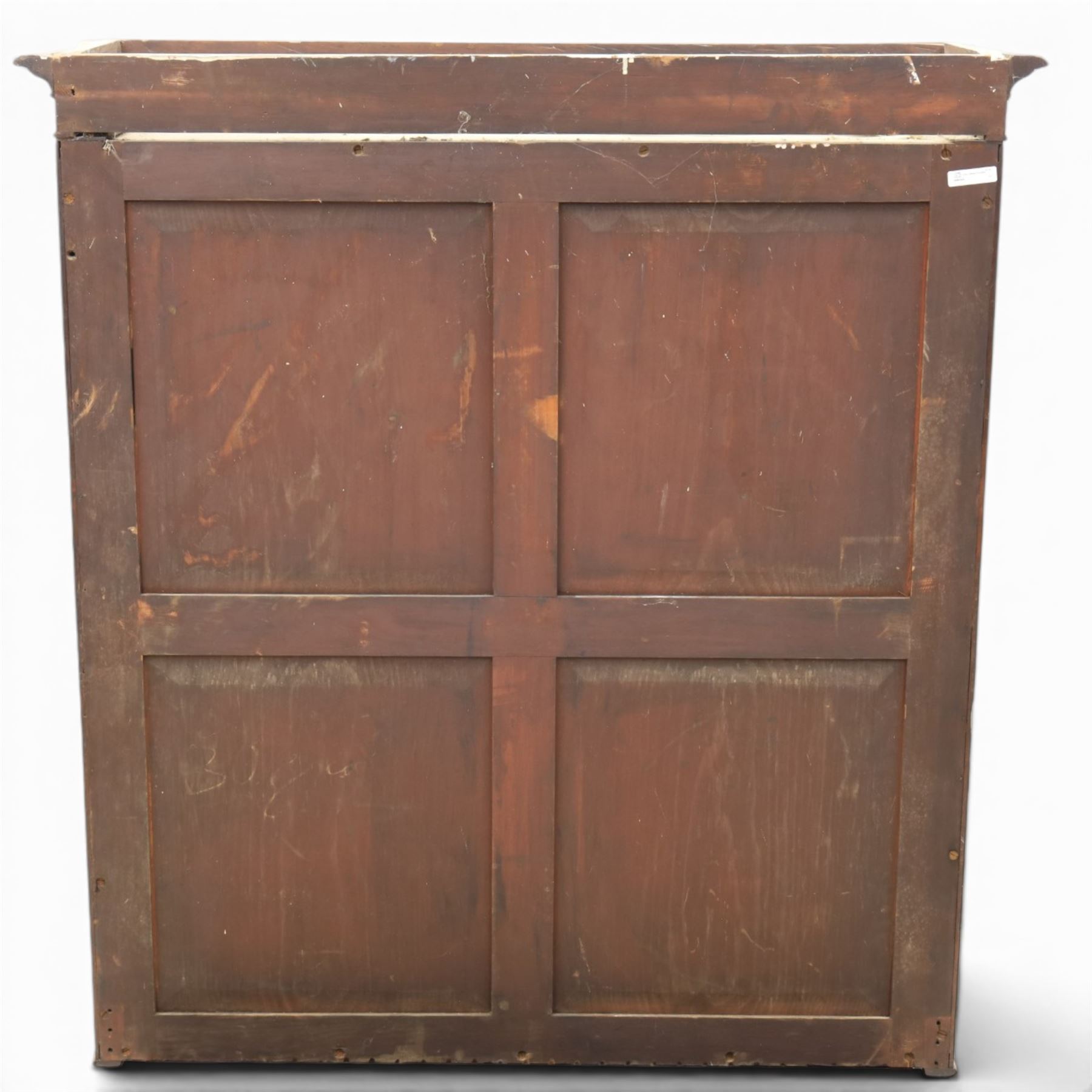 Early 19th century mahogany secretaire-bookcase, projecting cornice above astragal glazed cabinet with adjustable shelved interior, fall front secretaire drawer, fitted interior with pigeonholes and drawers, flame mahogany fronted cabinet with three drawers, on turned supports 