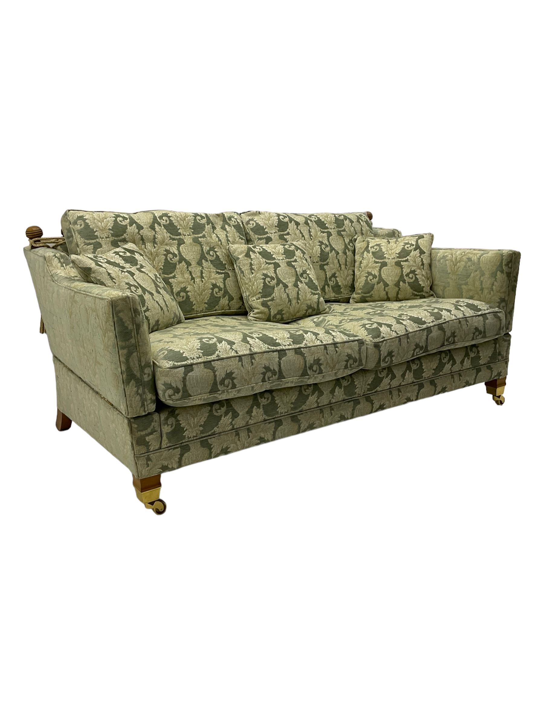 Three-piece hardwood-framed lounge suite - large two-seat Knole sofa with drop ends, upholstered in patterned fabric decorated with urns and foliage (W190cm, D117cm, H88cm); armchair upholstered in contrasting geometric pattern fabric (W83cm, D102cm, H93cm); and another armchair (W82cm, D102cm, H92cm) (3)