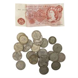 Three King George V pre-1920 silver florin coins, twenty three pre-1947 silver florins, one silver shilling, and a ten shilling note
