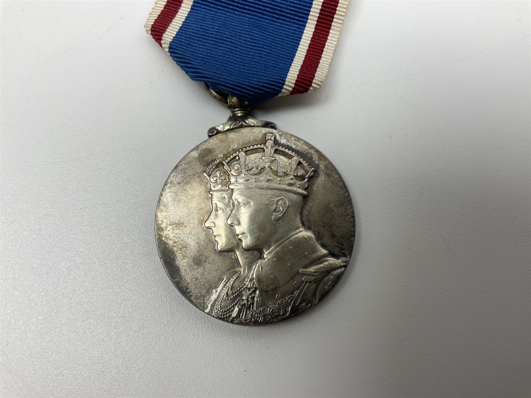 Collection of WW2 and police medals c.1933-1955, awarded to Eric Drinkwater comprising 1939-45 War Medal, Defence Medal, 1939-45 Star and Burma Star, on wearing bar; 1918-62 General Service Medal with Cyprus clasp to P.S. E.G. Drinkwater; boxed; Police Long Service and Good Conduct Medal to Const. Eric C. Drinkwater; cased; Royal Life Saving Society bronze medal to E.C. Drinkwater July 1933; boxed; and George V 1937 coronation medallion; boxed.