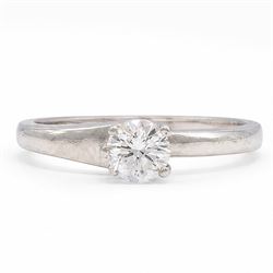 Platinum single stone diamond crossover ring, single round brilliant cut diamond of 0.50 c...