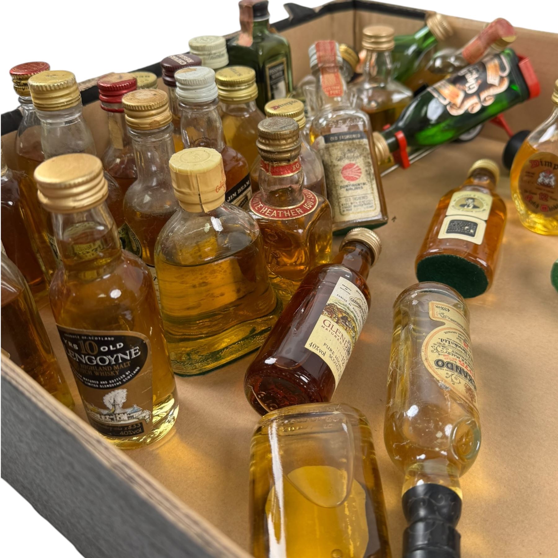 Collection of miniature whisky, including Glendronach 12 year old highland scotch whisky, Knockando 1975 pure scotch whisky, Isle of Jura pure malt scotch whisky etc, together with a bottle of Dow's Ruby Port, verious contents and proof  