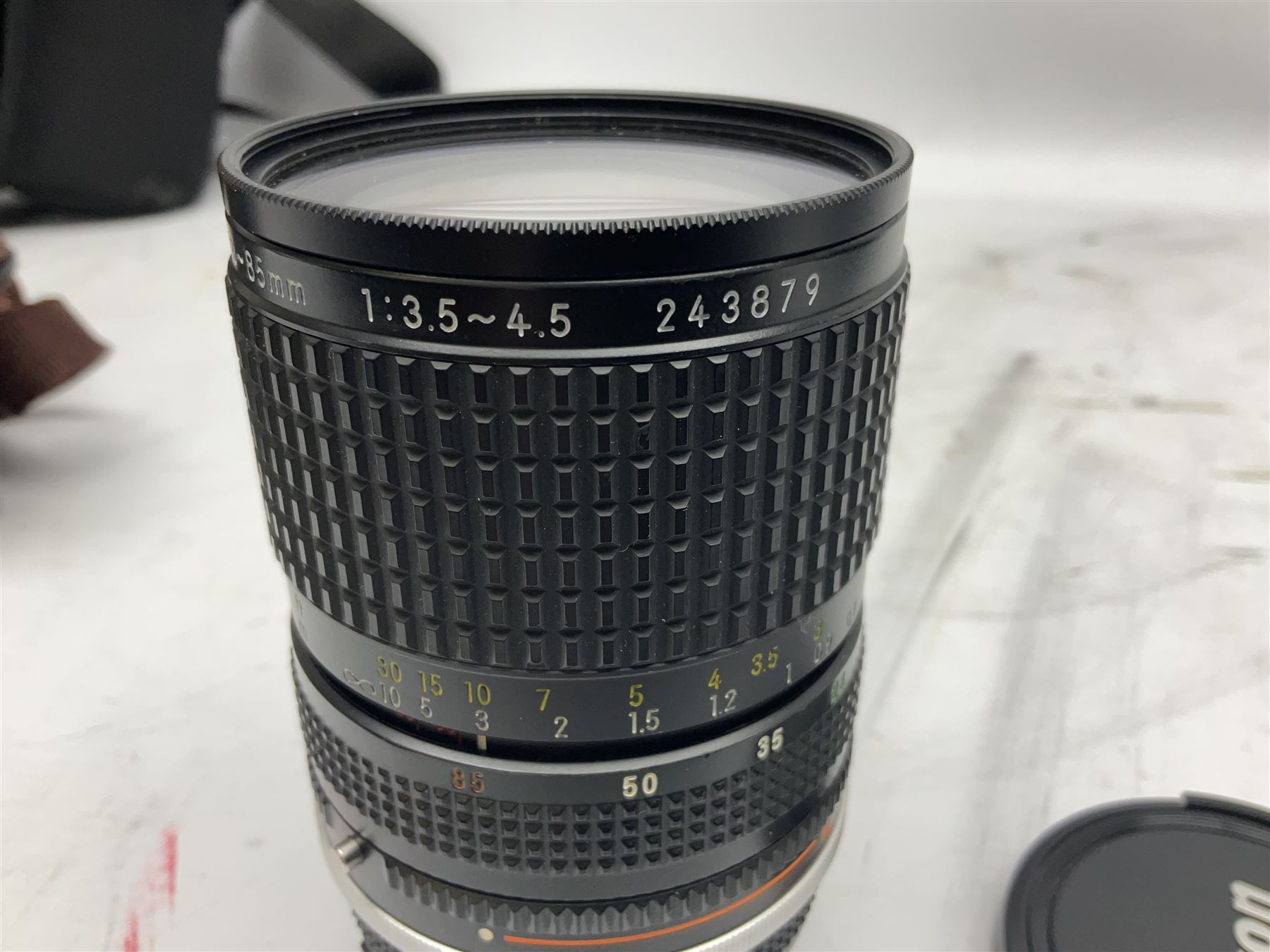 Nikon F3 SLR camera, serial number 1583609; Nikon 50mm 1:1.8 lens; Nikon 28-85mm 1:3.5-4.5 zoom lens; Vivitar MC 2X-3 Tele Converter, and a Nikon Speedlight SB-16 flash