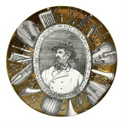 Fornasetti Grandi Maestri plate, depicting Giuseppe Verdi within a border of operatic emblems on gilt ground, with printed mark beneath, D25cm 