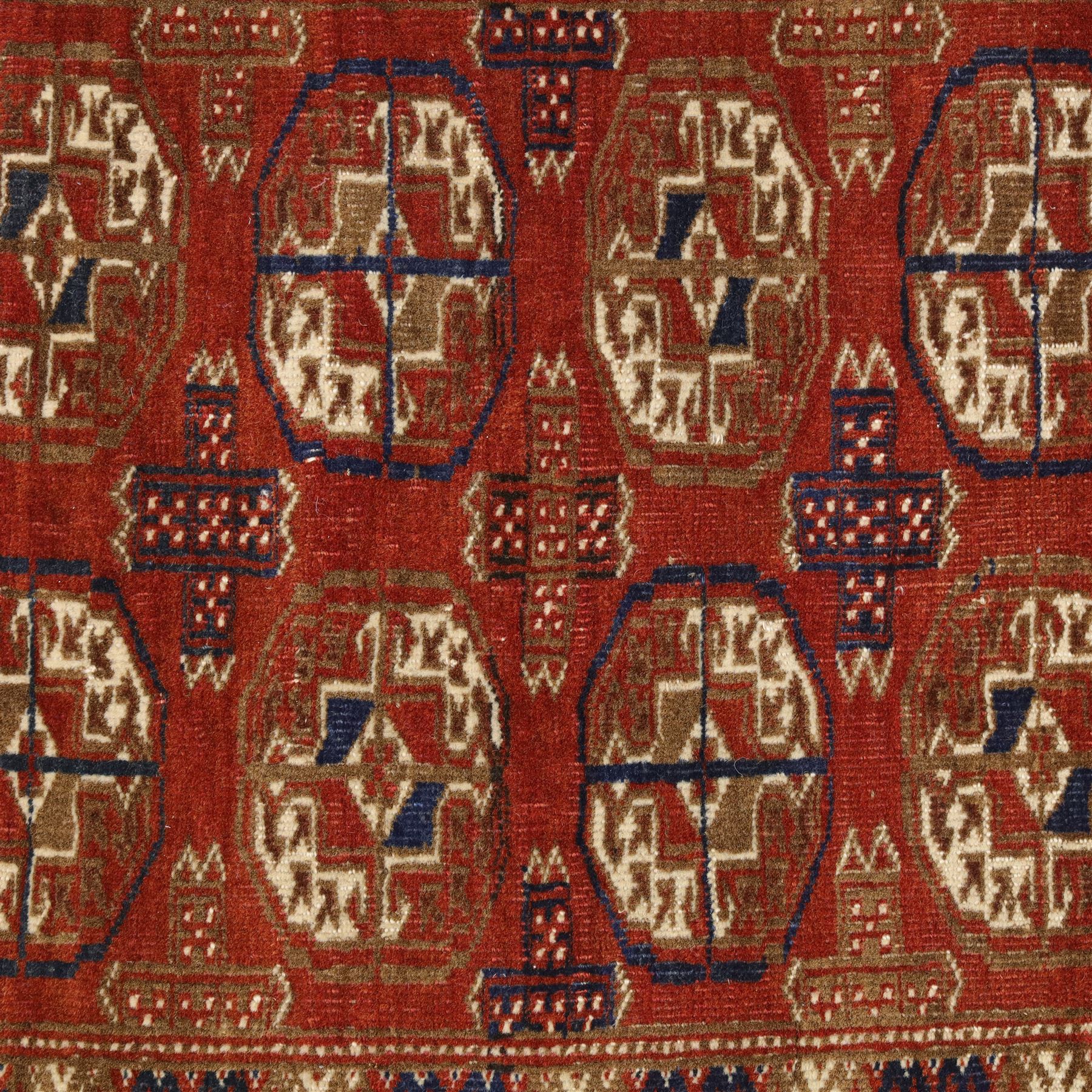 Tekke Turkman rug, madder red field decorated with repeating rows of octagonal guls, framed by multiple geometric borders, 86x133cm and an Anatolian flatweave kilim, 95x140cm, (2)