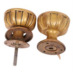 Late 19th century brass door knob set and brass letter box cover for Phoenix Assurance Company Limited, the door knobs each cast with fluted sides, the fronts with deep cast phoenix, square spindle shaft, each approximately L7.5cm, the letter box cover inscribed Phoenix beneath rectangular letter recess and flap, 19cm x 28cm
