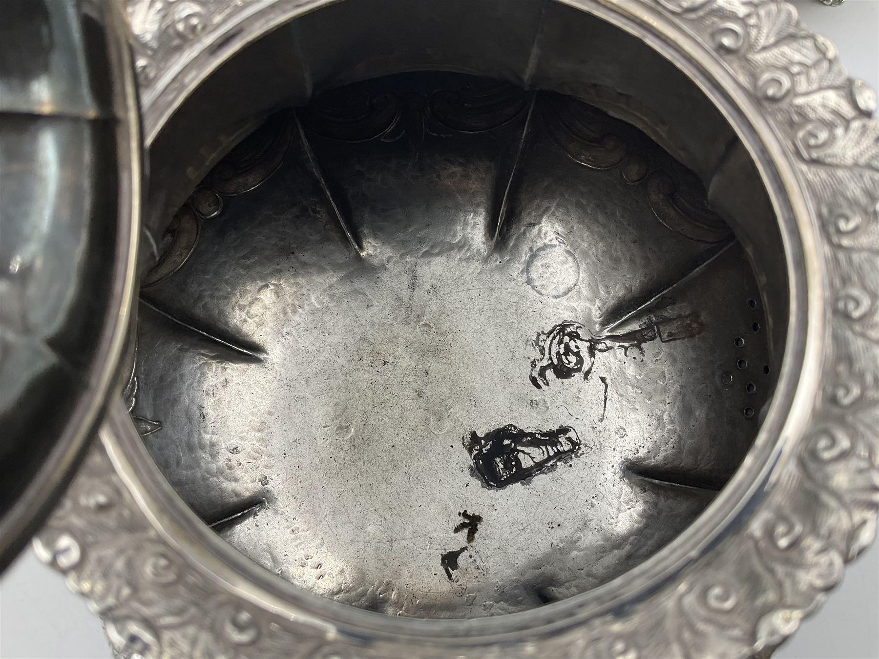 Victorian silver three piece tea service, comprising teapot, twin handled open sucrier, and milk jug, each of bellied form with acanthus capped scroll handles, the sides embossed with alternating scroll edged vacant panels and panels containing a pair of birds, upon four palmette feet, the teapot with ivory insulators to handle, and bird finial to the hinged domed cover, hallmarked William Hunter & Son, London 1861, teapot H19cm, including handles sucrier H13.5cm, including handle milk jug H12cm

This item has been registered for sale under Section 10 of the APHA Ivory Act