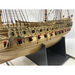 Wooden kit built model of HMS Neptune, 1:90 scale, with detailed rigging to three masts and a row of cannons to either side, upon ebonised wooden base, including stand H71cm