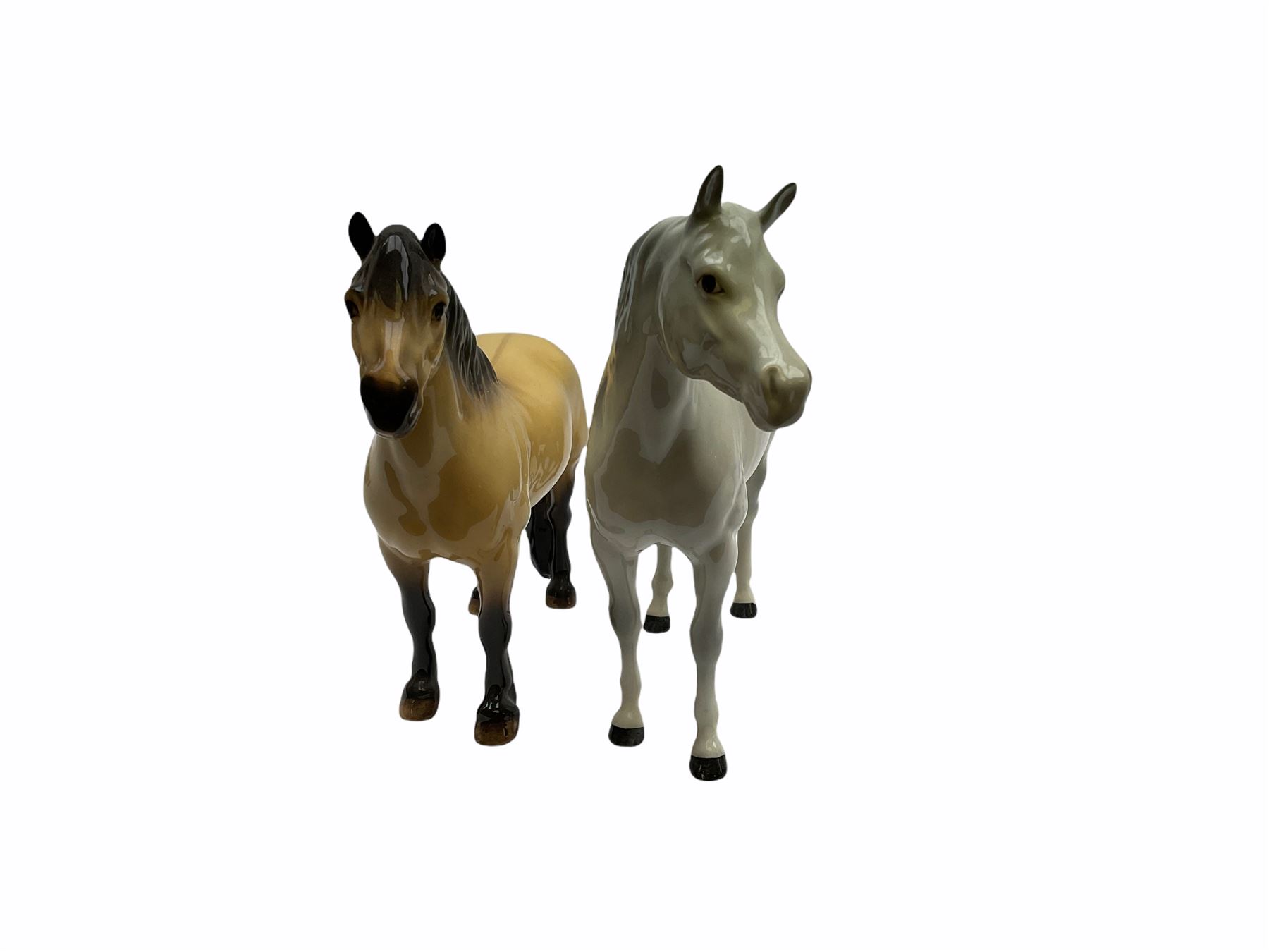 Beswick horse figures, comprising Highland Pony 1644, and another, probably Aran Bahram in grey, each with printed mark beneath.
