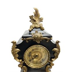 Ansonia - American late 19th century steel cased 8-day mantle clock in a Rococo case with decorative brass mounts, brass dial with Arabic numerals, steel hands and a repousse dial centre, twin train striking movement sounding the hours and half hours on a gong. with pendulum and key.