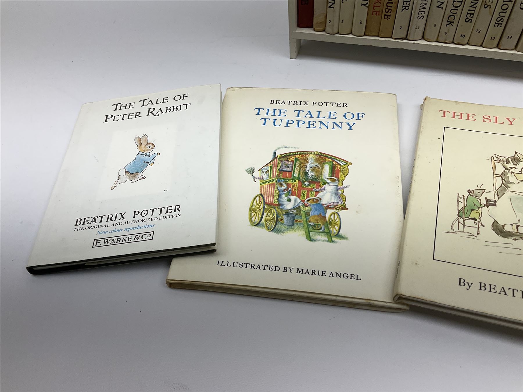 'Peter Rabbit's Book Shelf', containing selection of Beatrix Potter books, mostly library editions, shelf H29cm L27.5cm D11.5cm