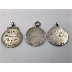 Seven early 20th century silver gold faced cartouche fobs, to include a circular example, with rose gold border and cartouche within an embossed yellow gold border, engraved verso, and a double sided example, all hallmarked with various dates and makers

