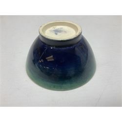Small Moorcroft footed bowl, together with a Doulton Lambeth vase, both with imprinted marks beneath, bowl D8.5cm