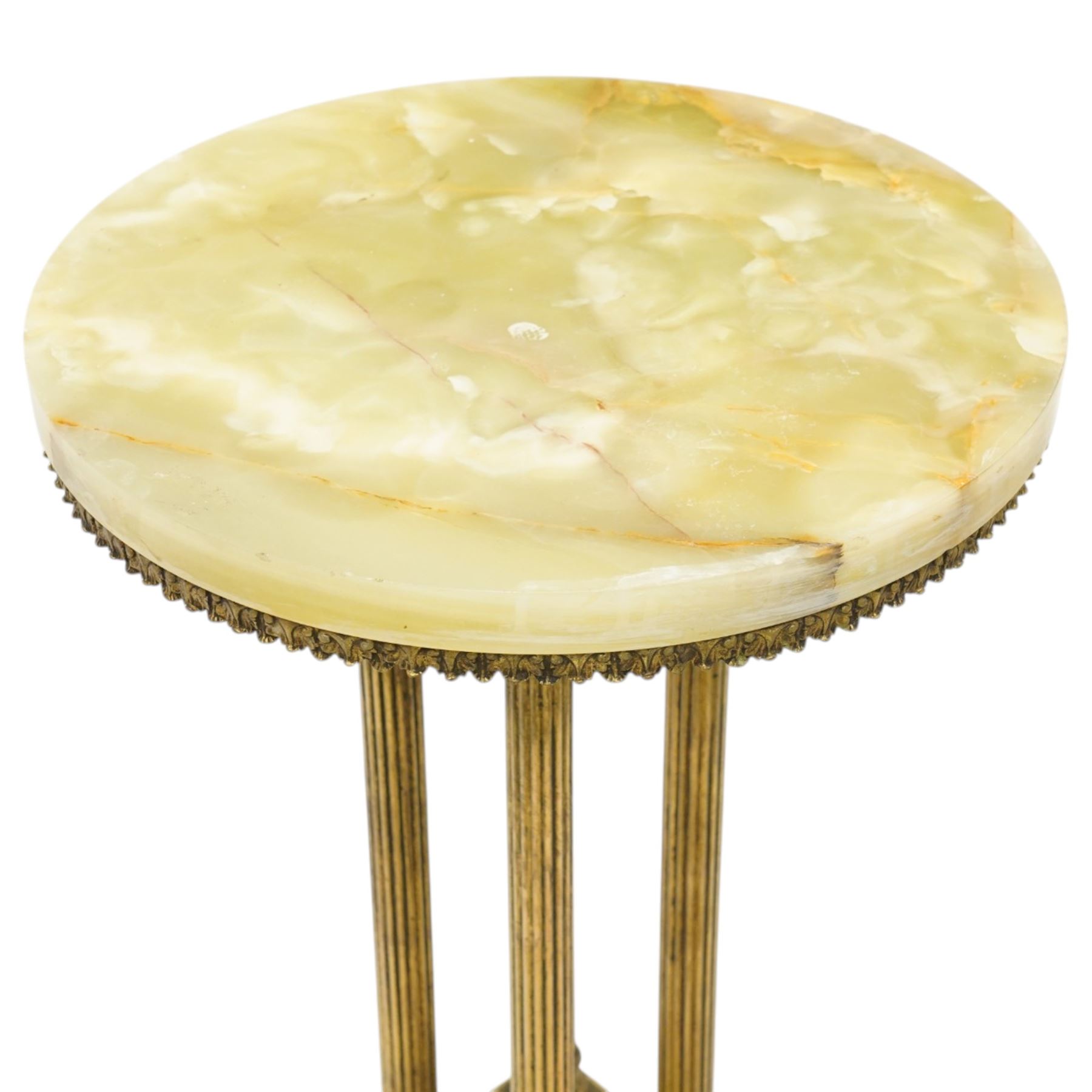 Neoclassical onyx and brass jardinière or plant stand, circular onyx top over an acanthus gilt frieze, supported by for fluted composite columns, square plinth with applied rosette mounts and stepped base, raised on scroll feet  