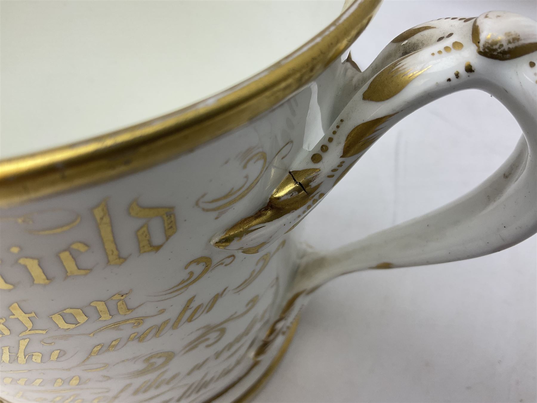 19th century loving cup, with decorated with religious iconography, a gilt rim and writing 'Henry Whittirld Wolverhampton, Whoever drinketh of the water shall thirst again but who soever drinketh of the water that i shall give him shall never thirst',  H14cm